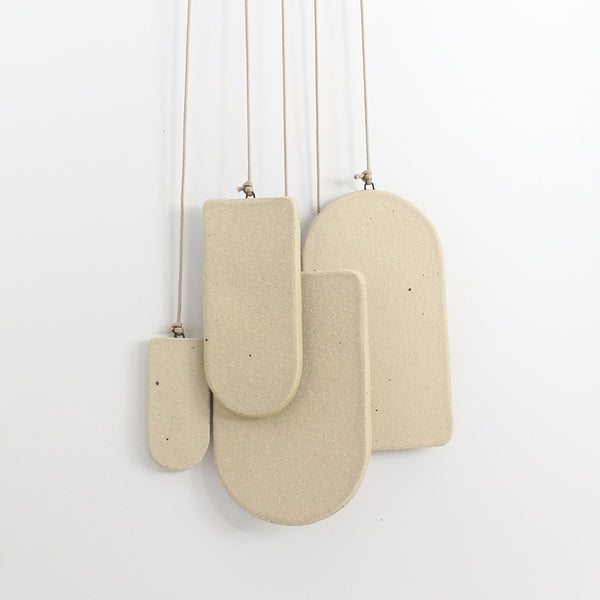 Blank stoneware underside of hanging shapes