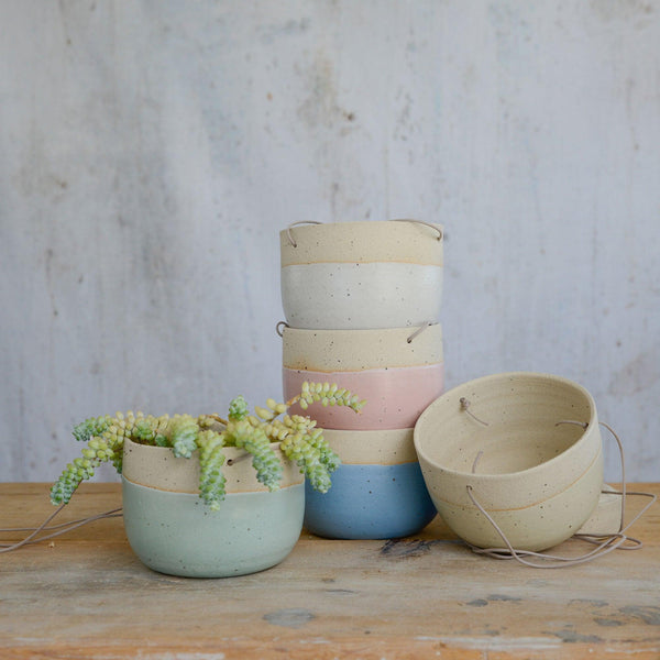 All 5 pastel coloured planters displayed at varyin angles