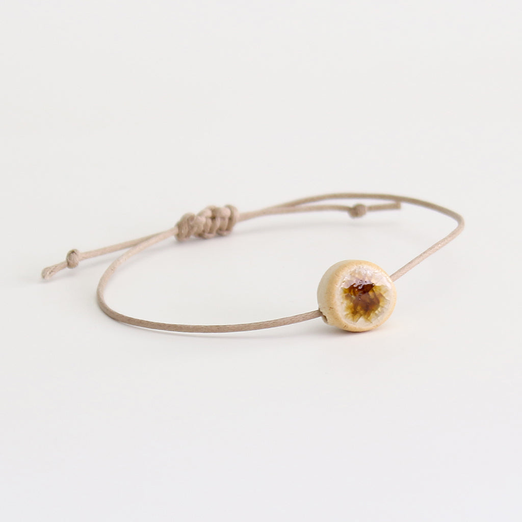 Recycled amber brown crackled glass ceramic circular bead light brown cord bracelet 