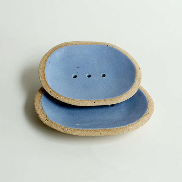 Small blue soap dish stacked on top of large for size comparison