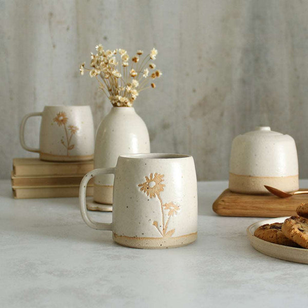 Aster mug in front of white ceramics table setting