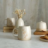 Cherry Blossom birth flower mug with white ceramics in background