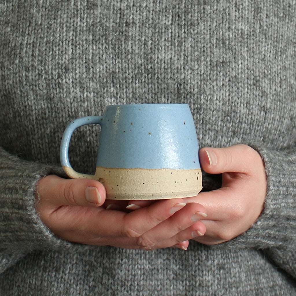 Hands holding Cornflower Blue Small Stoneware Mug
