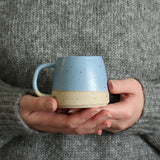 Hands holding Cornflower Blue Small Stoneware Mug