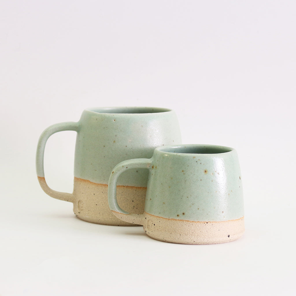 Small and large mint green stoneware mugs 