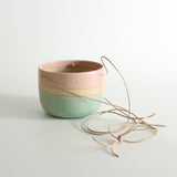 Cotton Candy hanging planter on white background with pale brown cord string