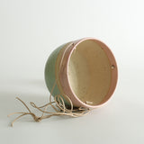 Cotton Candy planter on its side showing inner exposed fleck clay