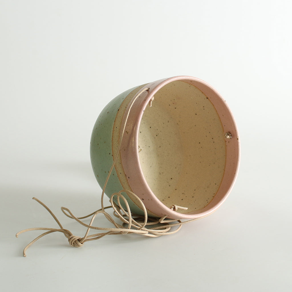 Cotton Candy planter on its side showing inner exposed fleck clay