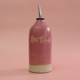 Handmade bright Pink Ceramic Oil Dispenser featuring 'Hot Stuff' text on a pink background