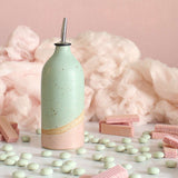Cotton Candy oil pourer next to wafers, mints and candyfloss