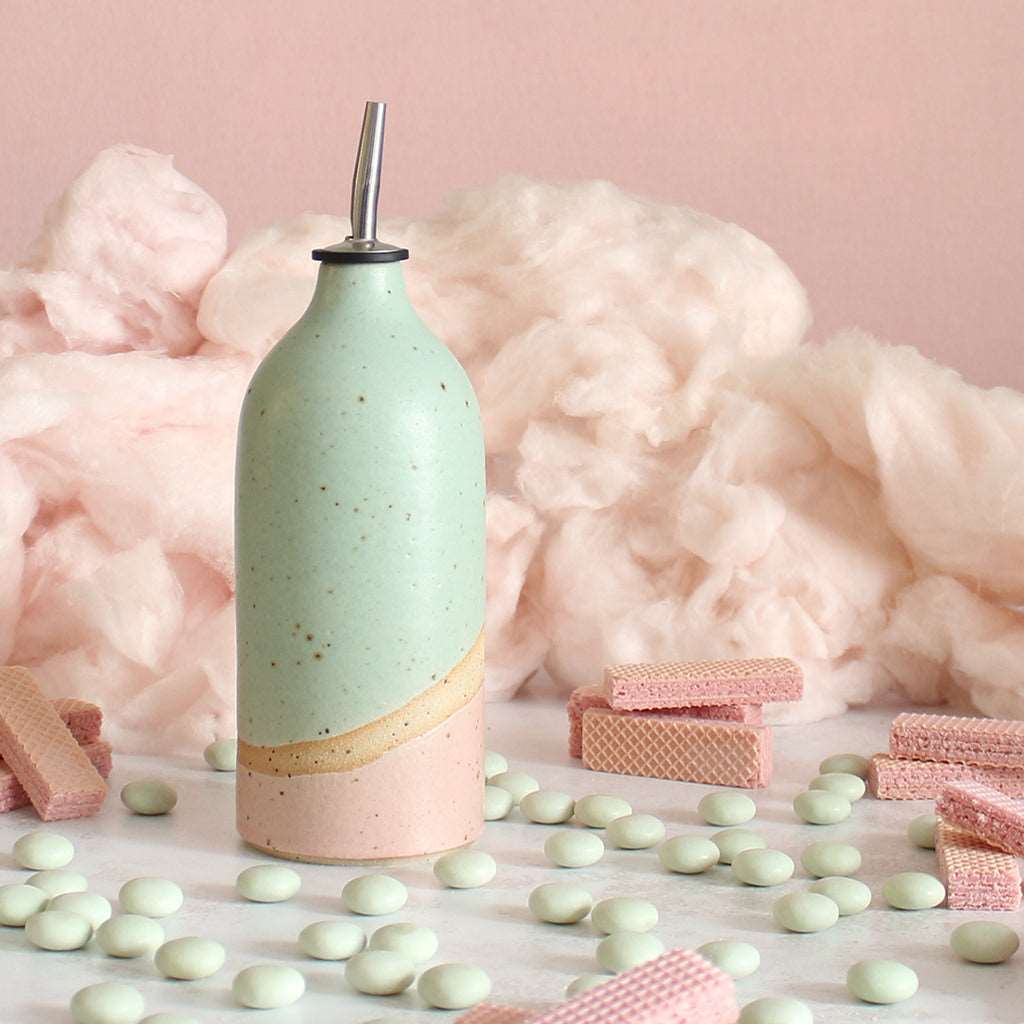 Cotton Candy oil pourer next to wafers, mints and candyfloss