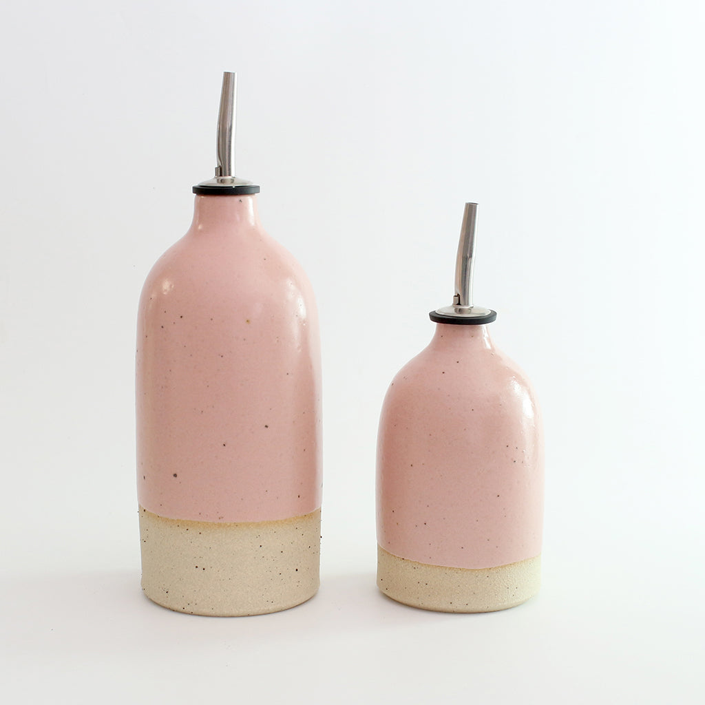 Size comparison of pink small and large oil pourer