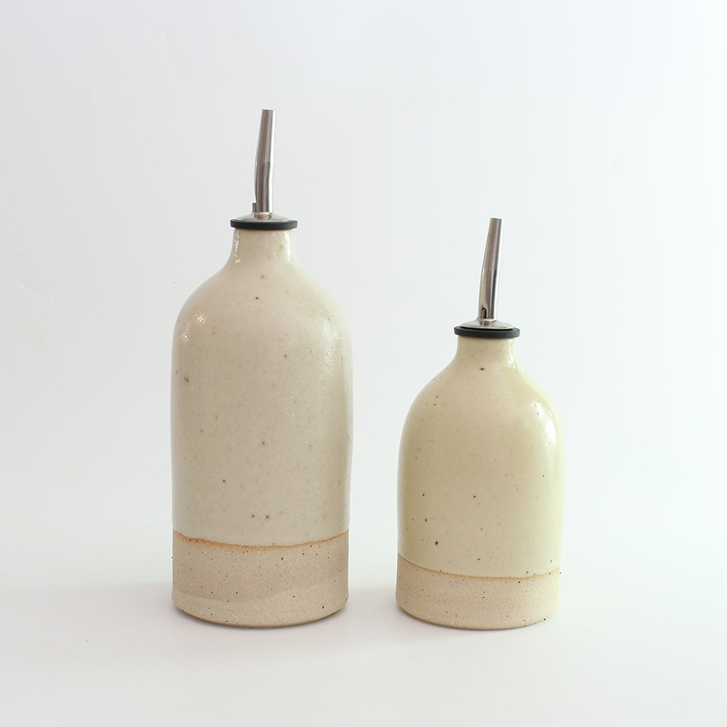 Size comparison of small and large yellow oil pourer