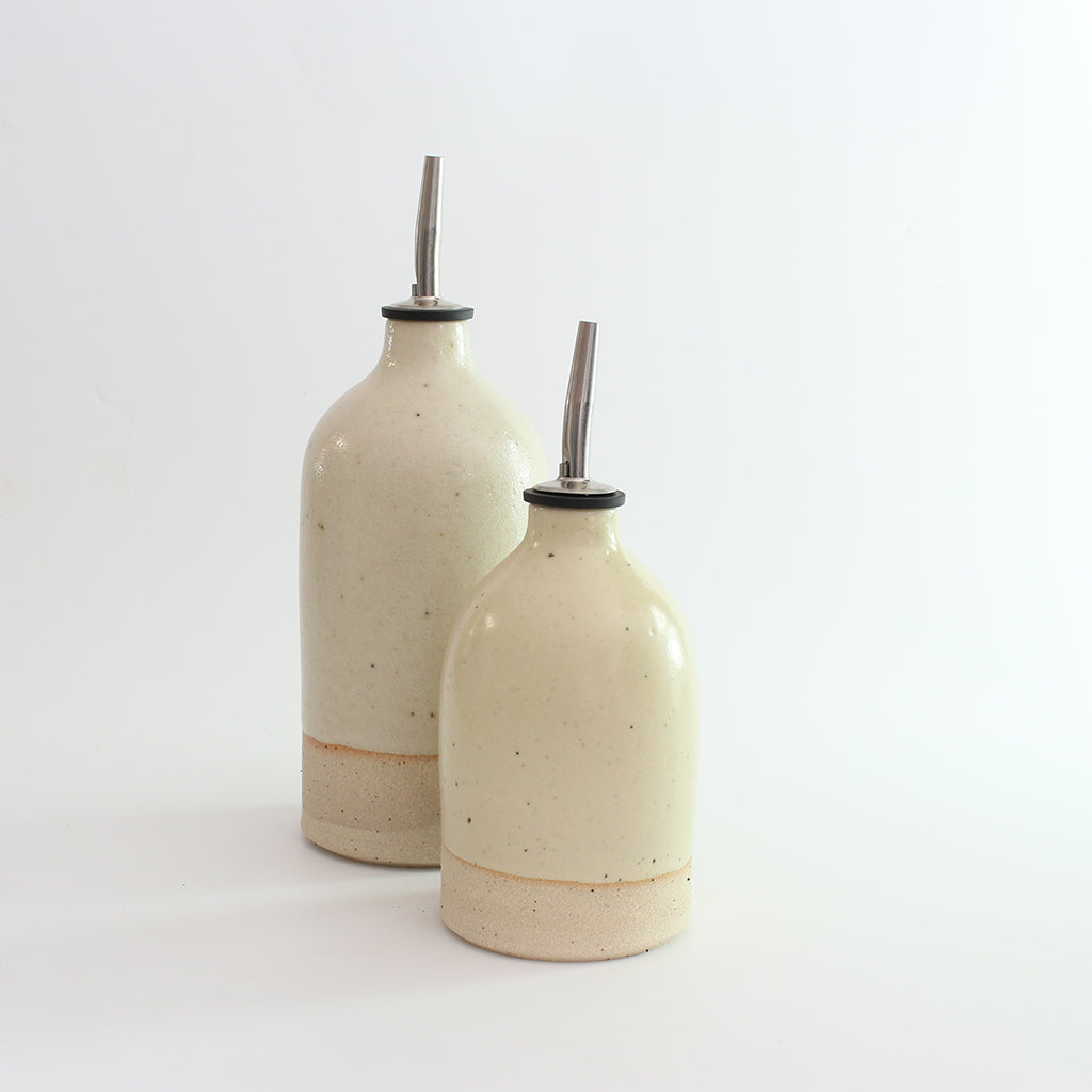 Yellow small and large oil pourer
