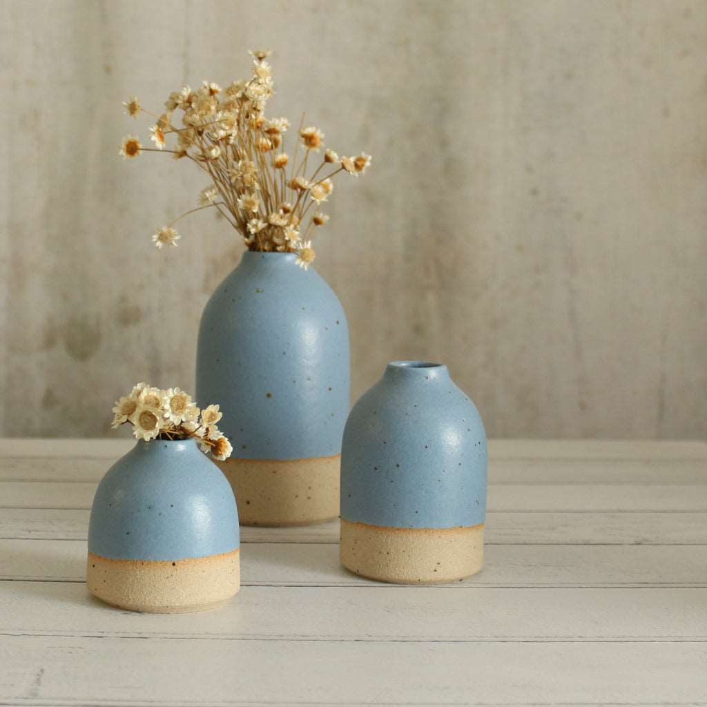 3 cornflower blue vases in different sizes