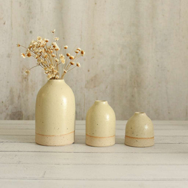 3 yellow bud vases