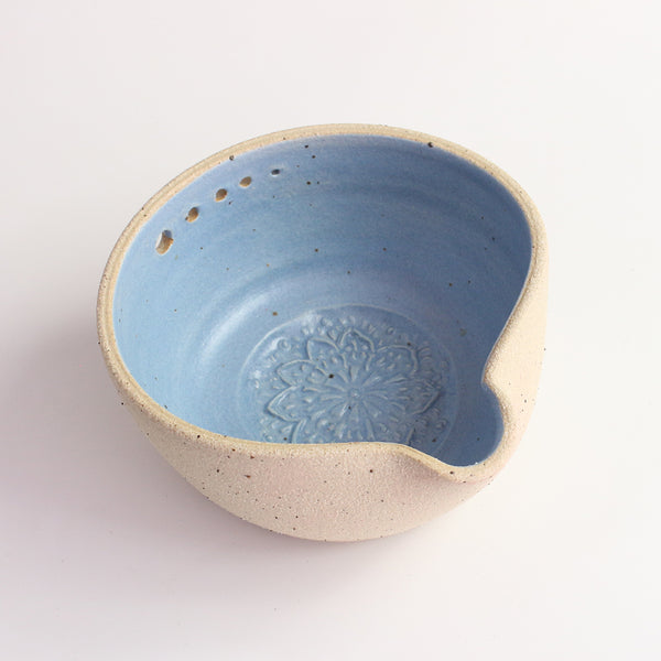 Above view of blue herb shredder bowl showing pattern inside