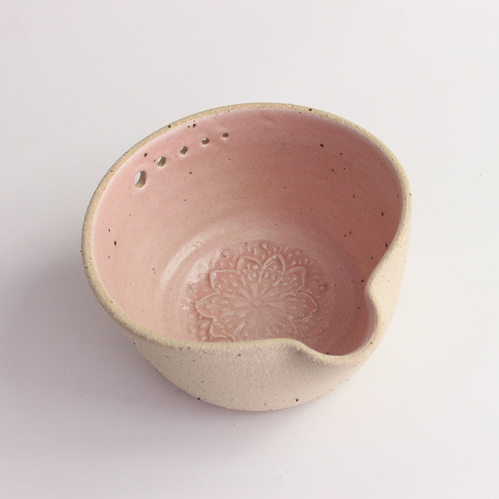 Above view of pink herb shredder bowl showing pattern inside
