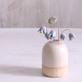 Pastel drop flower stems displayed in a handcrafted speckled vase – artisan home décor by Habulous.