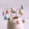 Pastel drop flower stems displayed in a handcrafted speckled vase – artisan home décor by Habulous.