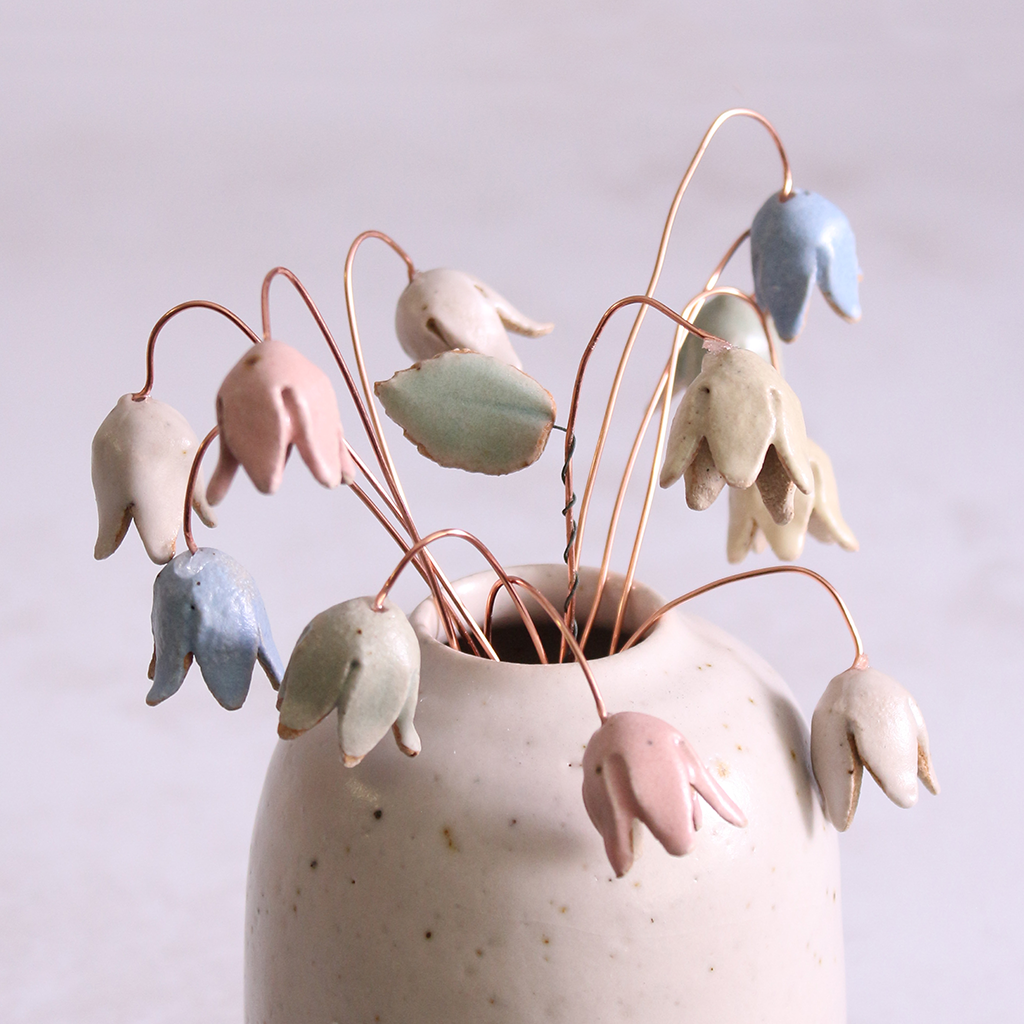Pastel drop flower stems displayed in a handcrafted speckled vase – artisan home décor by Habulous.