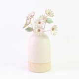 Ceramic daisy bouquet in a ceramic vase