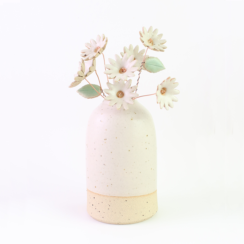 Ceramic daisy bouquet in a ceramic vase