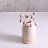 Pastel drop flower stems displayed in a handcrafted off-white speckled vase – artisan home décor by Habulous.