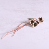 Close-up of pastel ceramic flower stems with copper wire stems – individually handcrafted floral home accessories from Habulous