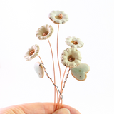 Ceramic Wildflower Bouquet being held by someone.