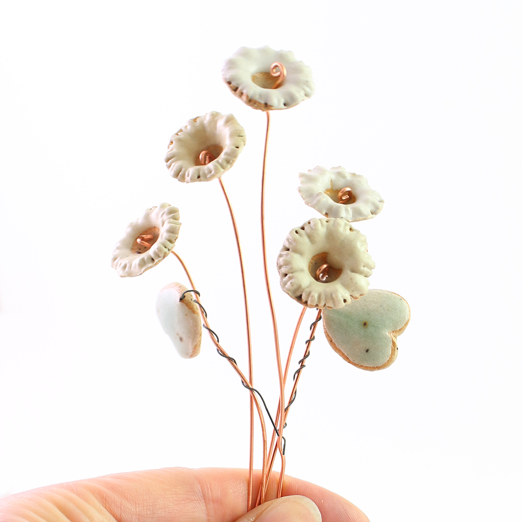 Ceramic Wildflower Bouquet being held by someone.