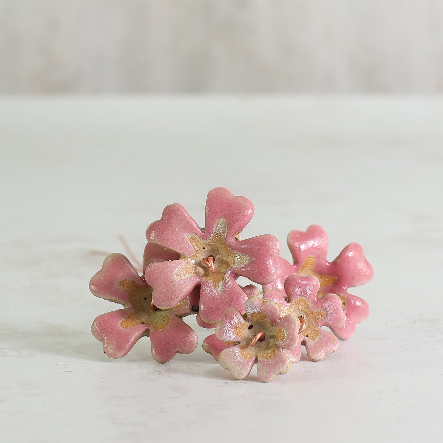 Pink Primrose ceramic flowers on a white background 