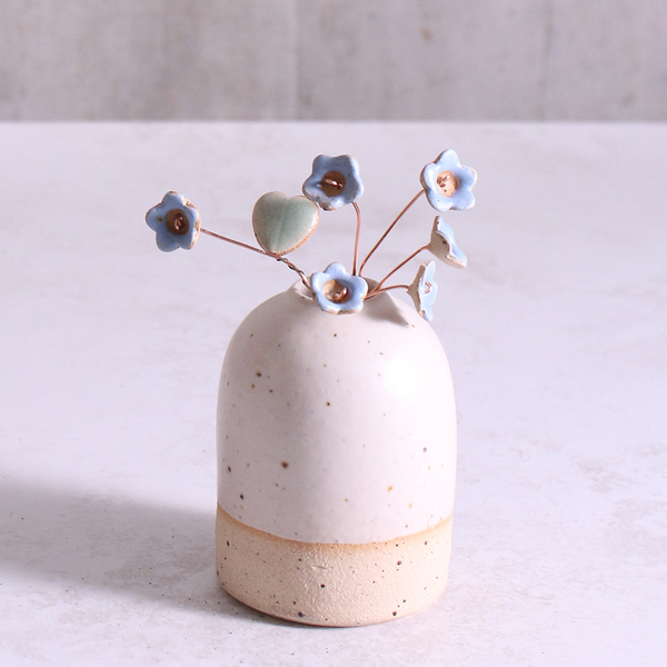 Pastel blue ceramic forget me not flower stems displayed in a handcrafted speckled vase – artisan home décor by Habulous