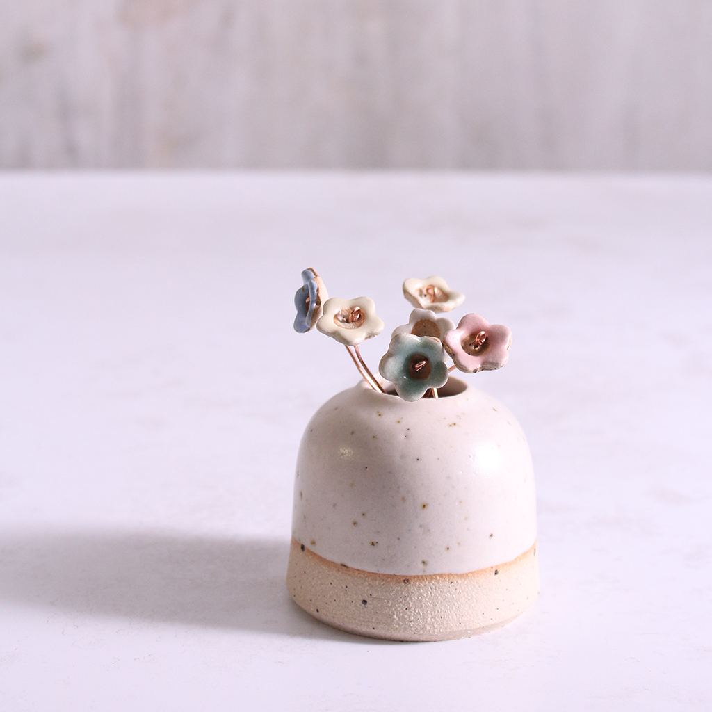 Pastel ceramic flower stems displayed in a handcrafted  ceramic vase – artisan home décor by Habulous