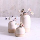 Pastel ceramic flower stems displayed in a handcrafted  ceramic vase – artisan home décor by Habulous