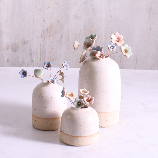 Pastel ceramic flower stems displayed in a handcrafted  ceramic vase – artisan home décor by Habulous