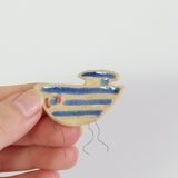 small ceramic and glass boat plant decoration