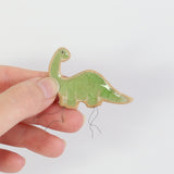 small ceramic and glass green brontosaurus dinosaur plant decoration