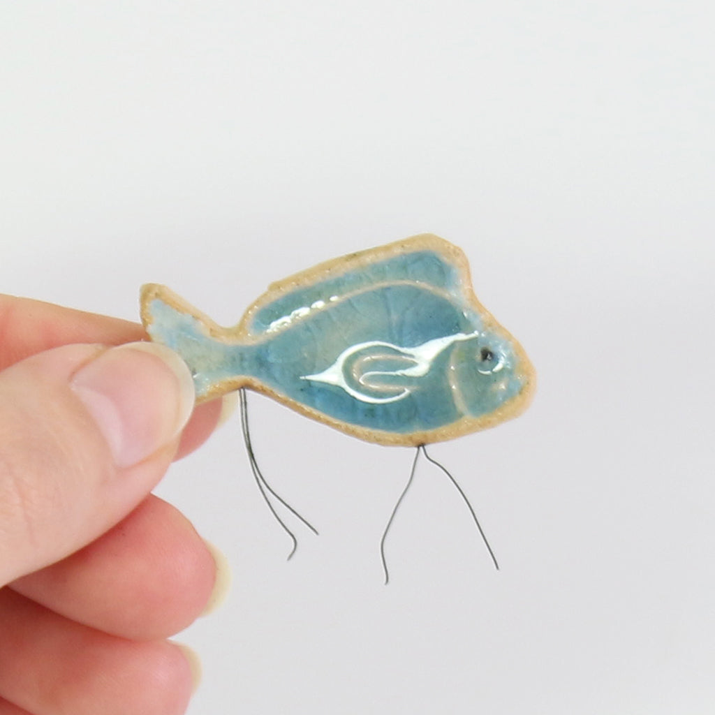 small ceramic and glass sapphire blue fish plant decoration