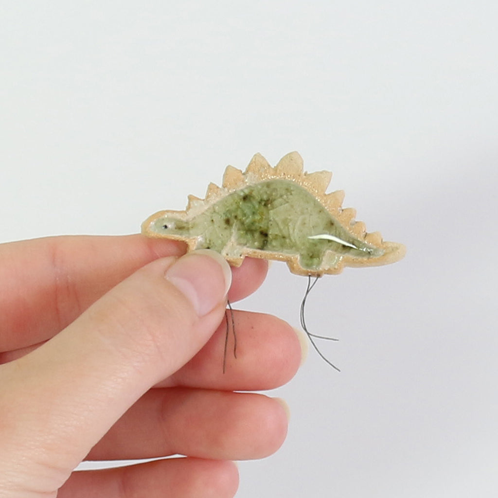 small ceramic and glass mottled hazel stegosaurus dinosaur plant decoration