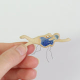 hand holding swimmer ceramic plant decoration