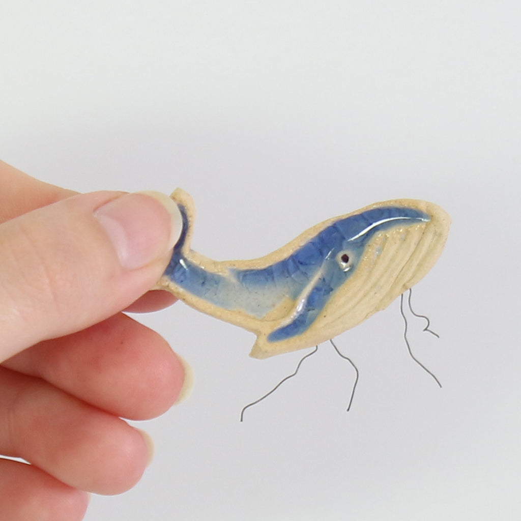 small ceramic and glass dark blue whale plant decoration