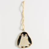 Christmas penguin decoration on a light gray background