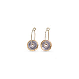 Pair of gold and purple hoop earrings with circular designs on a white background