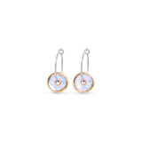 Pair of sterling silver earrings with circular designs on a white background