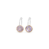 Pair of earrings with circular designs on a white background
