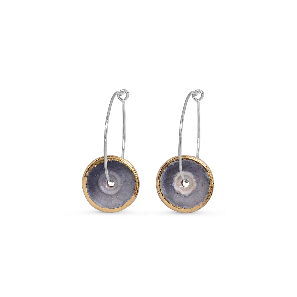 smoky purple sterling silver hoop earrings with a gold rim on a white background