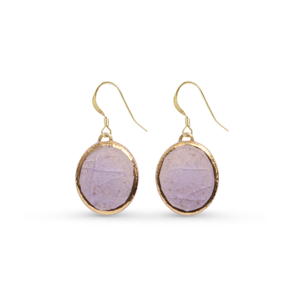 Gold-framed purple stone earrings on a white background