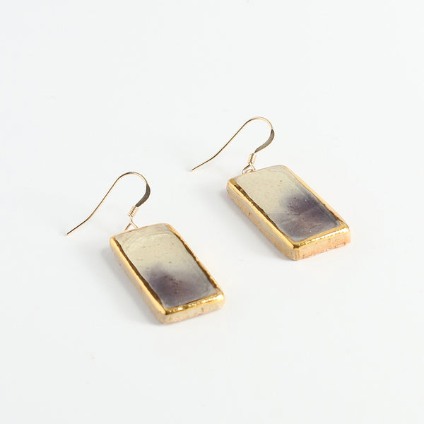 Rectangular earrings with gold frames on a white background