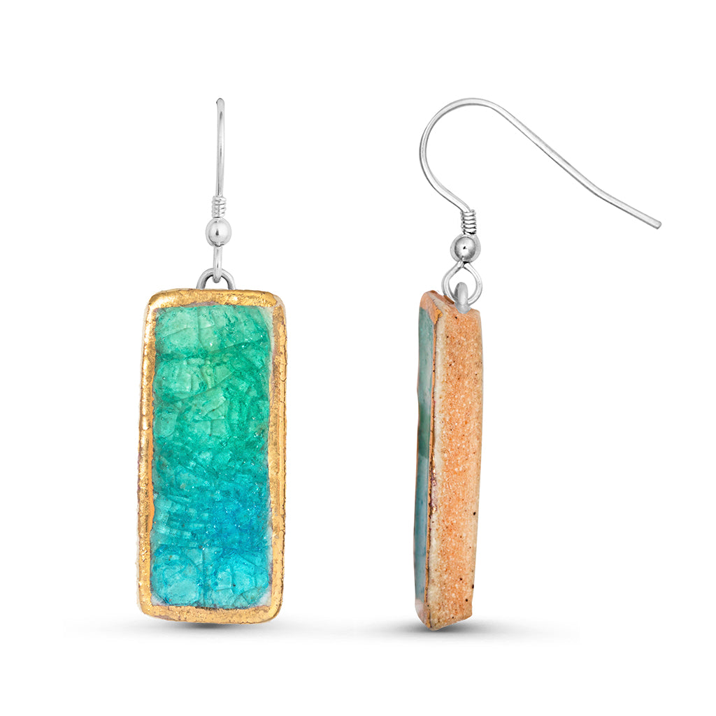 Side view of emerald turquoise gradient lagoon glass rectangular sterling silver drop earrings outlined in gold lustre
